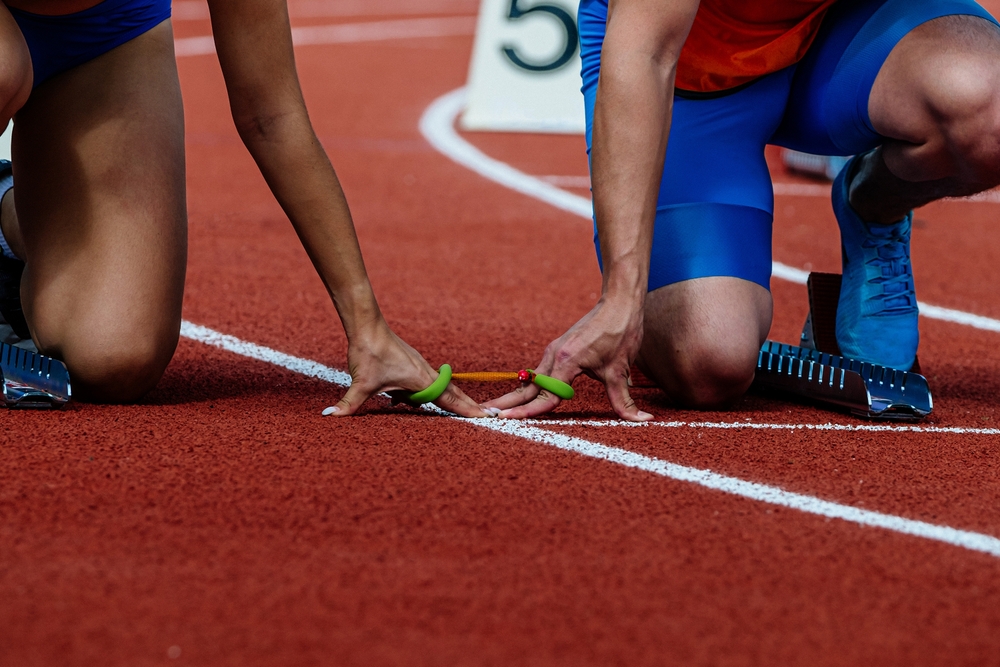 two track athletes starting race