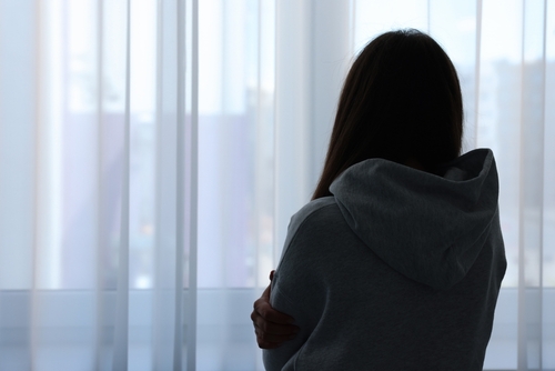 woman looking at the window